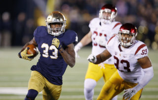 Josh Adams takes off against USC